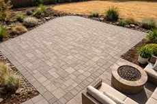 Hardscaping in Orangevale CA by McGuire Earth Works - completed paver patio with herringbone pattern and stone border